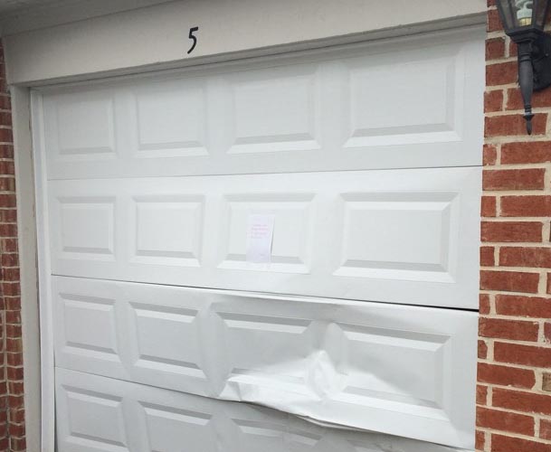 damaged single car garage door